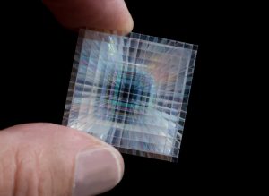 Hand holding tiny, multi-colored imaging array